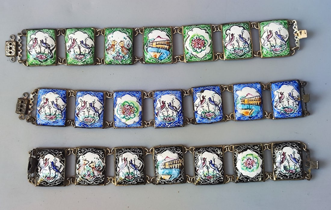 An assortment of 3 old Persian enamel link bracelets: An assortment of 3 old Persian enamel link bracelets, circa mid-20th century, decorated with hand-painted patterns of birds, flowers and a bridge over the river, on metal with a silver patina, length: