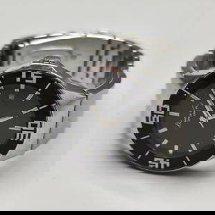 A fashionable and high-quality wristwatch for men made by Kenneth Cole: Fashionable and high-quality men's wristwatch made by Kenneth Cole, New York, stainless steel case and band, black face decorated with line numerals, date scale at 3 o'clock, black frame with minute m