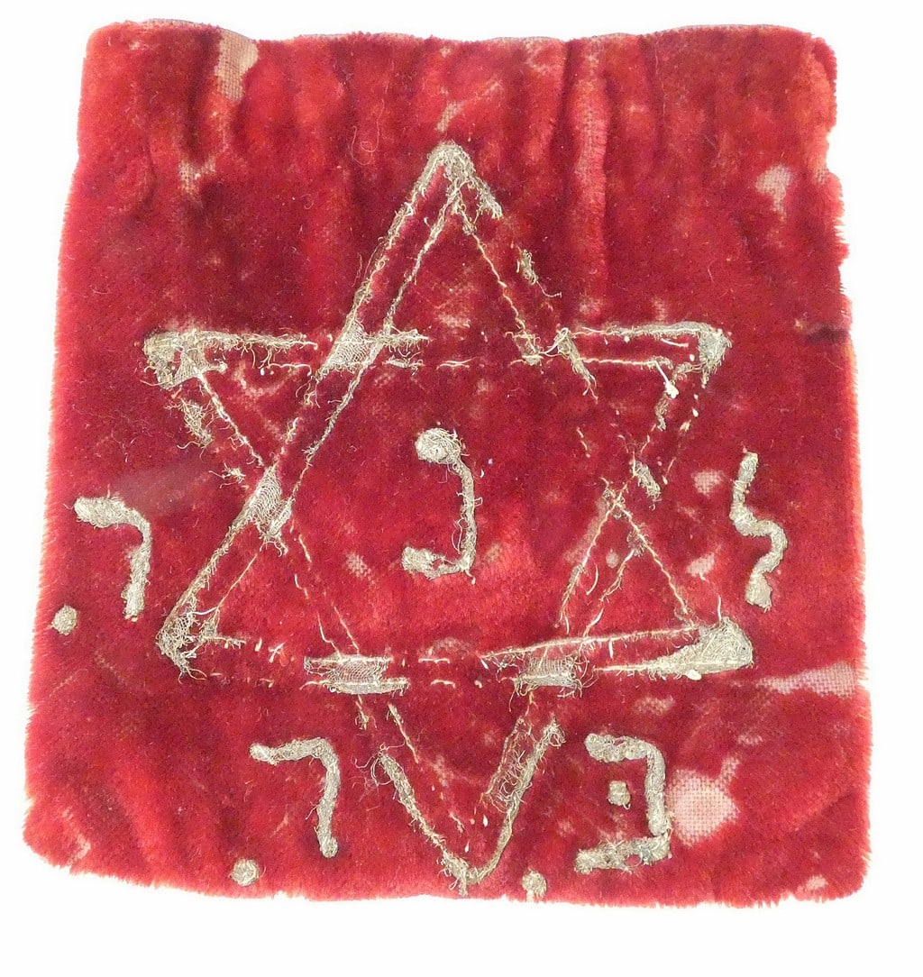 Antique embroidered Magen David on red velvet bag for Tefillin Phylacteries.: Antique embroidered Magen David on red velvet bag for Tefillin Phylacteries. Size: 18 x 17.5 cm. (7 x 6.8 inches) Wear, rubbing, missing parts of embroidery