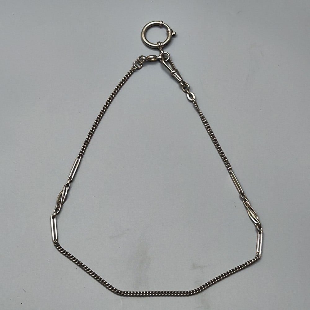 Antique carrying link chain for a pocket watch: Ancient chain of carrying links for a pocket watch, combined with a number of elongated links, including two hoops and holding rings at each of its ends, length: 25 cm.