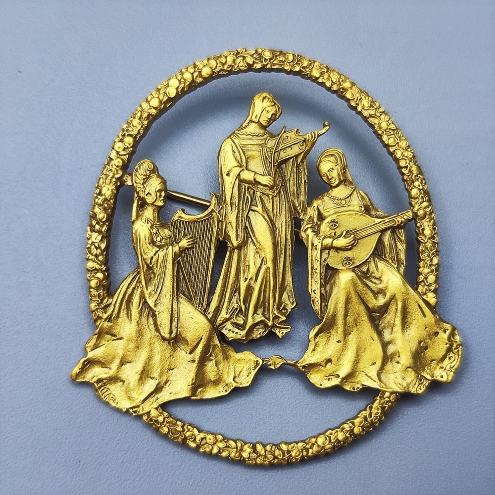 Decorative gilded brooch of a three-woman medieval orchestra published by the MFA (Museum of Fine (1 of 2)