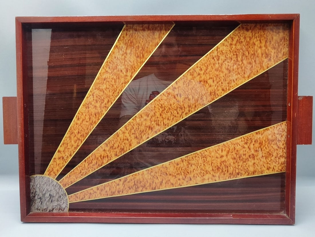 French Art Deco wooden tray: French Art Deco wooden tray, designed in a rectangular model with two rectangular handles at the lateral edges, decorated with a "sunrays" pattern on a glossy veneer background, dimensions: 51X34.5 cm