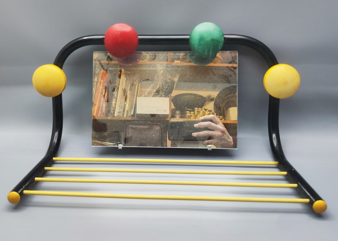 Sputnik Coat Rack Space Age designed after Roger Feraud: Sputnik Coat Rack Space Age designed after Roger Feraud, circa 1960s, made of blackened metal and combined with colorful polymer material: 4 hanger strips in a gold-tone color and 4 hangers), with a r