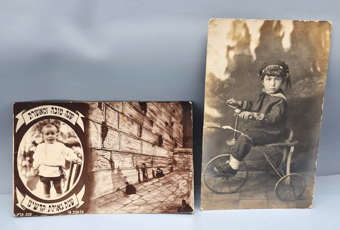 Lot of Mandate Period Shana Tovah postcards, photomontage and photography "Good Child Jerusalem": Lot of Mandate Period New Year's Eve postcards, photomontage and photography "Good Child Jerusalem", circa 1930s, the Shana Tovah postcard is decorated with a scene of people praying at the Western Wa