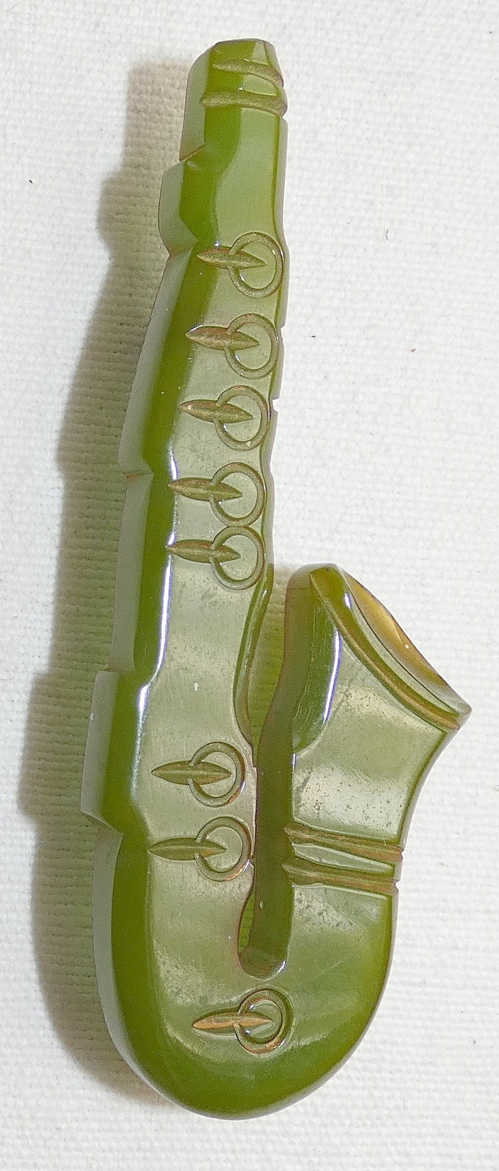 Art Deco engraved green Bakelite Saxophone Brooch, tested (1 of 3)