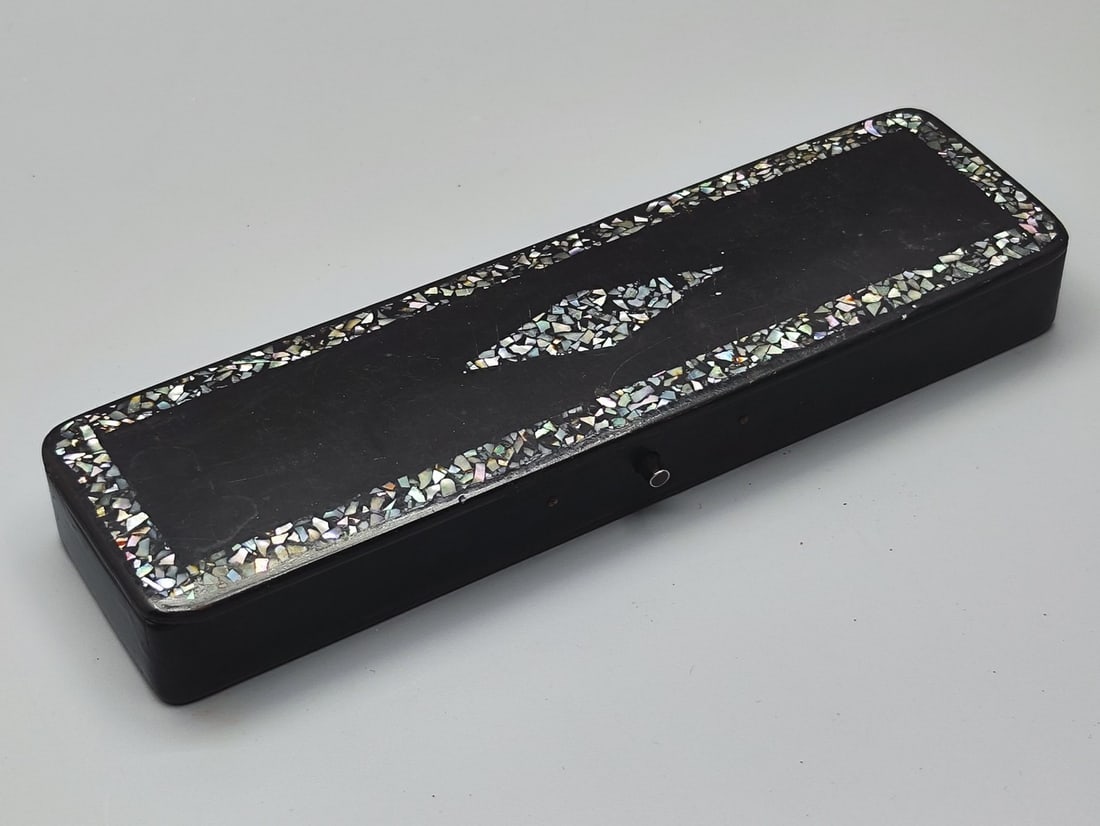 Antique German Papier-mache and Mother of Pearl pencil case: Antique German Papier-mache and Mother of Pearl pencil case, circa 1900, decorated with a lid inlaid with partial mother-of-pearl inlay in the center in a rhombus pattern and around the lid inscriptio