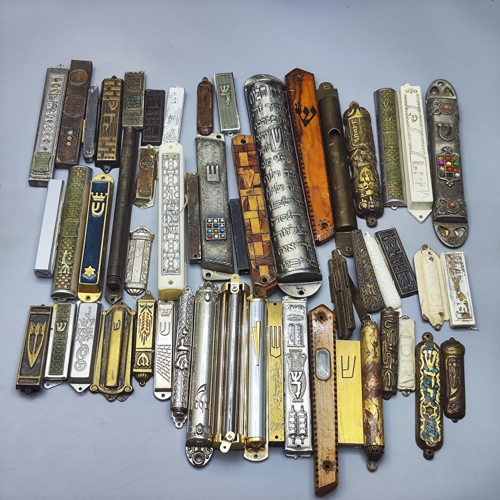 A large collection of decorative mezuzah cases (1 of 7)