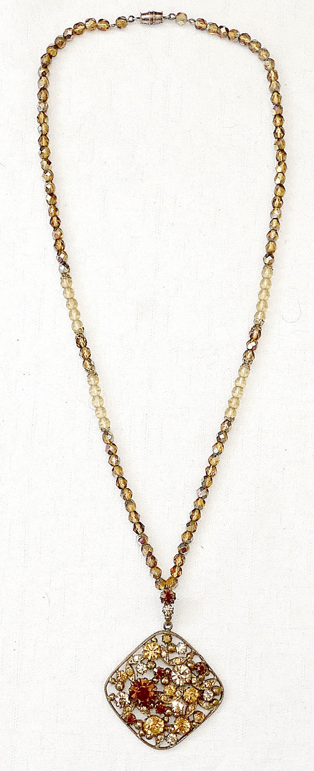 Czechoslovakia art deco multi color rhinestone necklace.: Czechoslovakia art deco multi color rhinestone necklace. Length to neck: 57 cm. (22.4 inches) Diameter of faceted crystal beads: 4.5 mm. size of pendant: 5 x 5 cm. (1.9 x 1.9 inches) Weight: 35 gr.