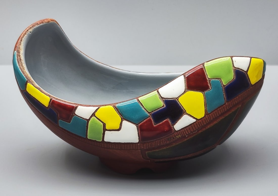 Vintage Israeli ceramic bowl made by "Keramos": Vintage Israeli ceramic bowl made by "Keramos", circa mid-20th century, decorated with a colorful mosaic pattern with glaze on a red-brown background, signed at the bottom and numbered, dimensions: 15
