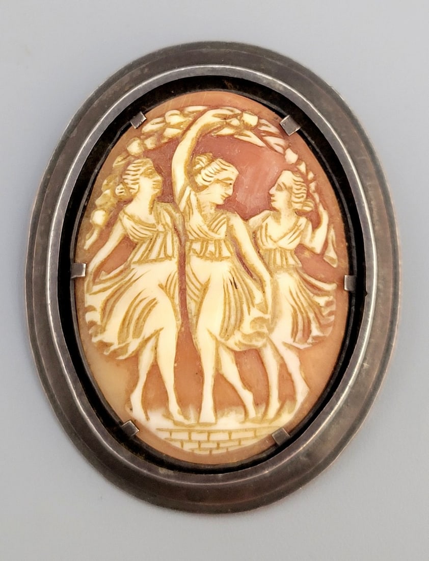 Silver brooch-pendant and antique cameo: Antique silver and cameo pin-pendant, circa 1900, thick silver frame, inlaid with a natural seashell cameo carved by hand by an artist in the pattern of three women (the three graces?), unsigned: acid