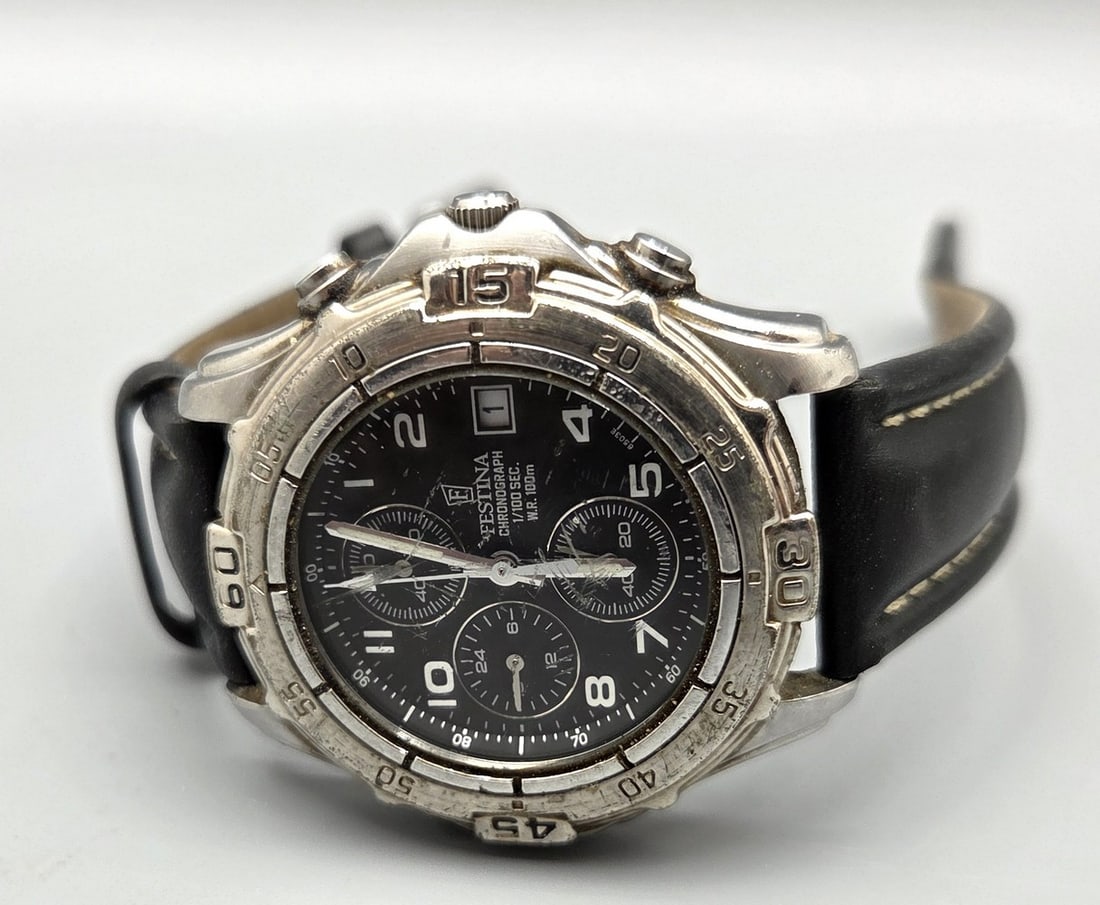 Wristwatch made by Festina chronograph model 6503: Wristwatch made by Festina chronograph model 6503, stainless steel case, black face with division, Arabic numerals, date at 3 o'clock, black leather band, quartz movement (battery), not tested, workin