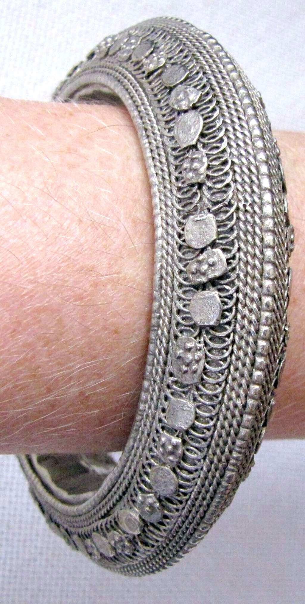 Indo-Persian antique tribal filigree silver bangle bracelet, 87gr.: Indo-Persian antique tribal filigree silver bangle bracelet, 87gr.Tested for silver by acidInner diameter: 7 cm. (2.7 inches)Total inner length: 21.5 cm (8.4 inches)Width: 2 cm. (0.8 inches)Thickness: