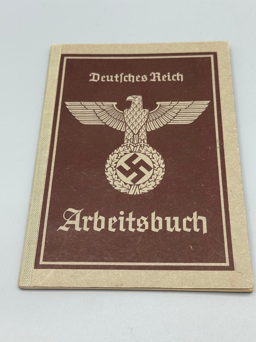 Workbook (Arbeitsbuch) - Citizen of the Third Reich: Workbook (Arbeitsbuch) - Third Reich citizen, second half of the 1930s, filled with handwritten details of the bookholder and the stamps of the workplaces where he worked. In very good condition, slig