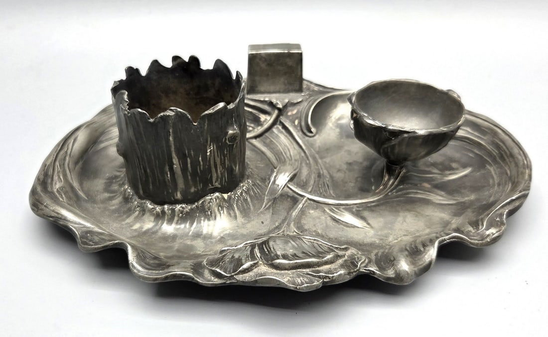 German Art Nouveau Pewter Smoking Set: Pewter smoking set by Dupper & Bernhold, Esslingen, Germany. Oval bowl with organic floral reliefs. Features a tree trunk cigarette holder, a water lily ashtray, and a matchbox holder. Signed "DBE