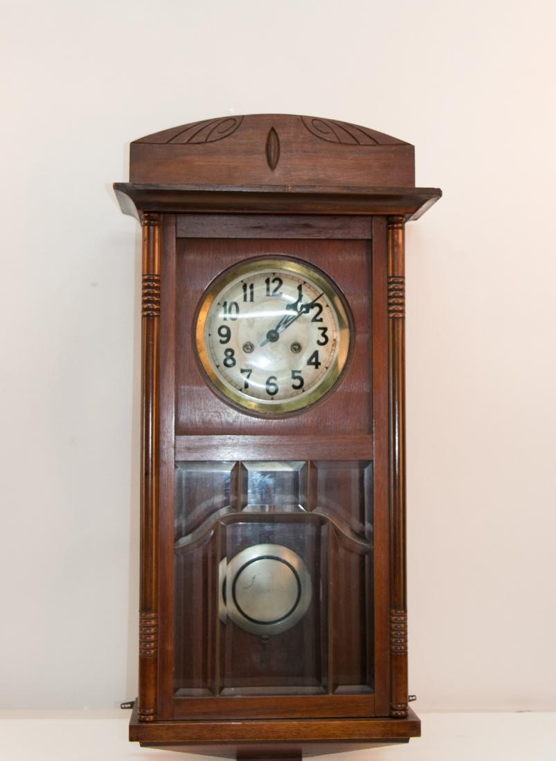 A germany hanging clock: A germany hanging clock. H33" W15" H6"
