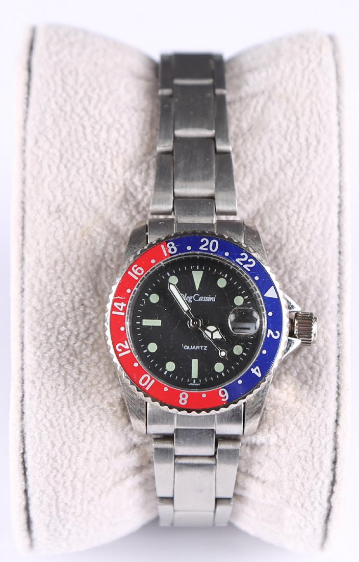 Oleg Cassini Quartz Watch: Title: Oleg Cassini Quartz Watch Shipping: shipping rates are determined by the distance from the auction site Important Information 1)Photos, descriptions, and estimates were prepared with the utmost