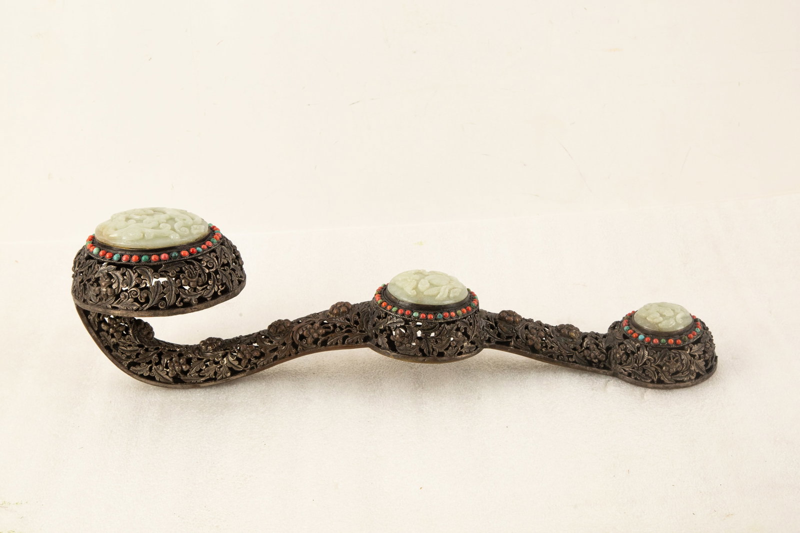 Chinese Style Openwork Metal Ornament with Carved Hardstone Insets: Title: Chinese Style Openwork Metal Ornament with Carved Hardstone Insets Medium: Metal, Carved Stone, and Bead Inlay Size: 6." H x 6." W x 21." L Condition: Good vintage condition with wear consisten