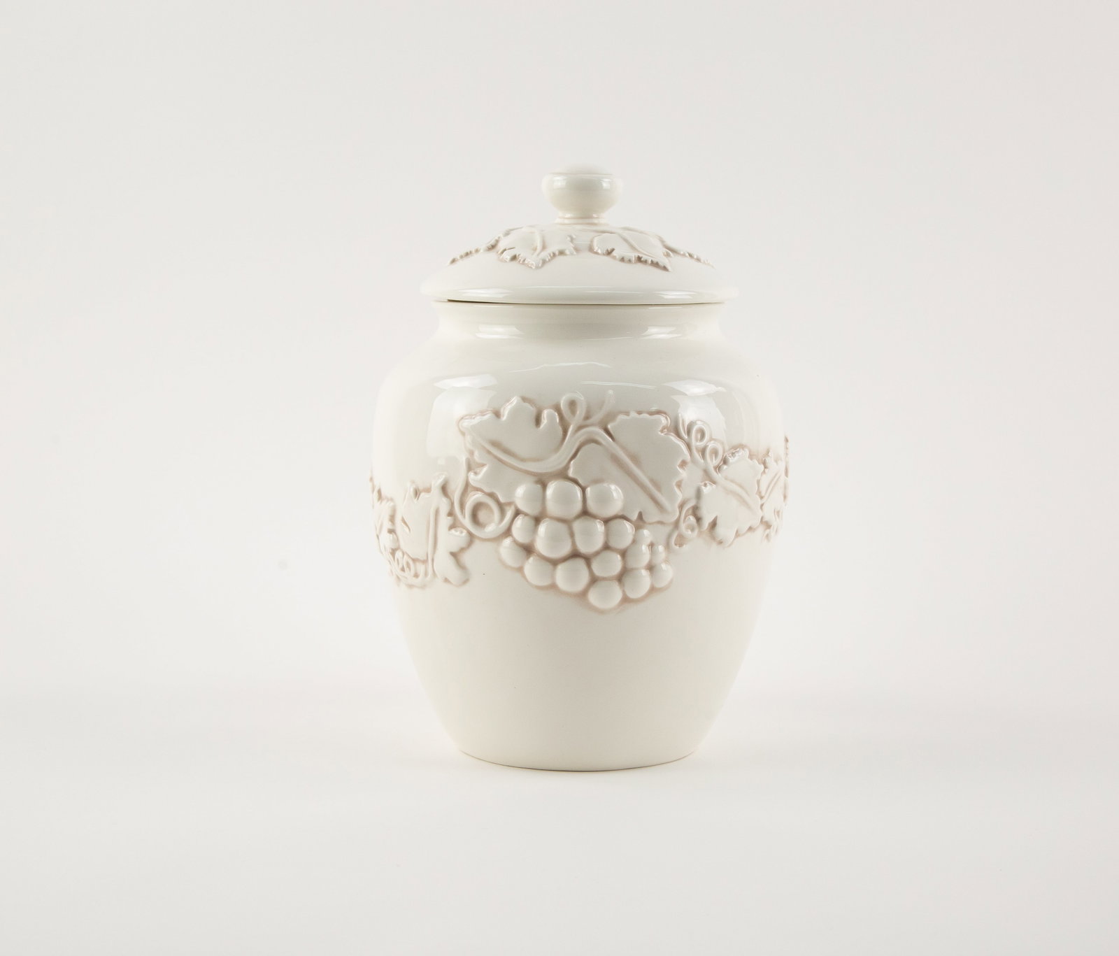 White Embossed Ceramic Canister With Lif: Size: H 11 x L 7 x W inches Condition: Good overall condition for its age. Shipping: shipping rates are determined by the distance from the auction site. C0003 Bidders need to know All the items are