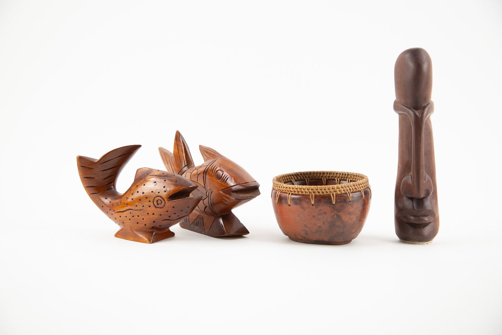 Group of Four Carved Wooden and Woven Decorative Objects: Size: H x L 18 x W 2 inches Condition: Good overall condition for its age. Shipping: shipping rates are determined by the distance from the auction site. C0006 Bidders need to know All the items are