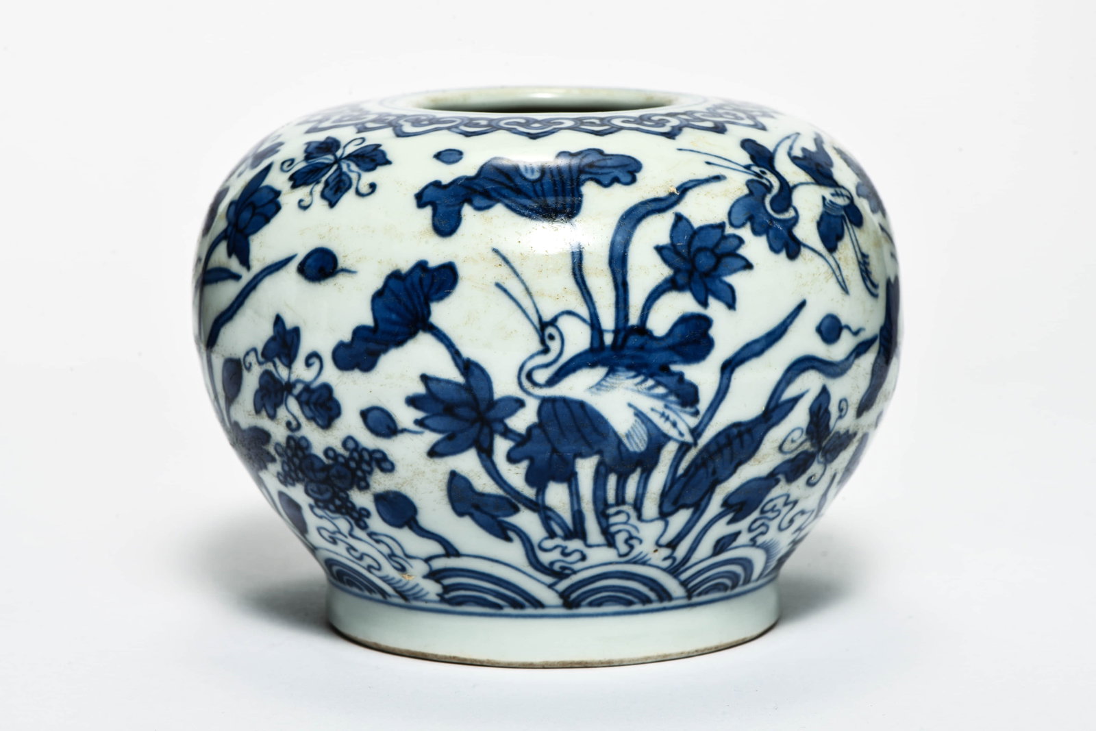 A blue and white 'Lotus' jar: A BLUE AND WHITE 'LOTUS' JAR Description: Length::14cm Width::14cm Height::11cm Bidders need to know All the items are sold as is and all sales are final. All bidders are encouraged to review our term