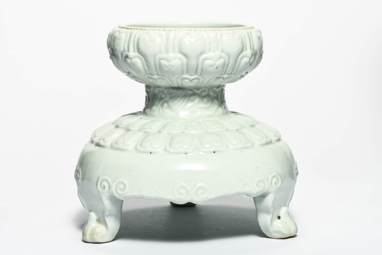A white-glazed incised 'Lotus petals' three-legged censer: A WHITE-GLAZED INCISED 'LOTUS PETALS' THREE-LEGGED CENSER Description: Length::18cm Width::18cm Height::20cm Bidders need to know All the items are sold as is and all sales are final. All bidders are 