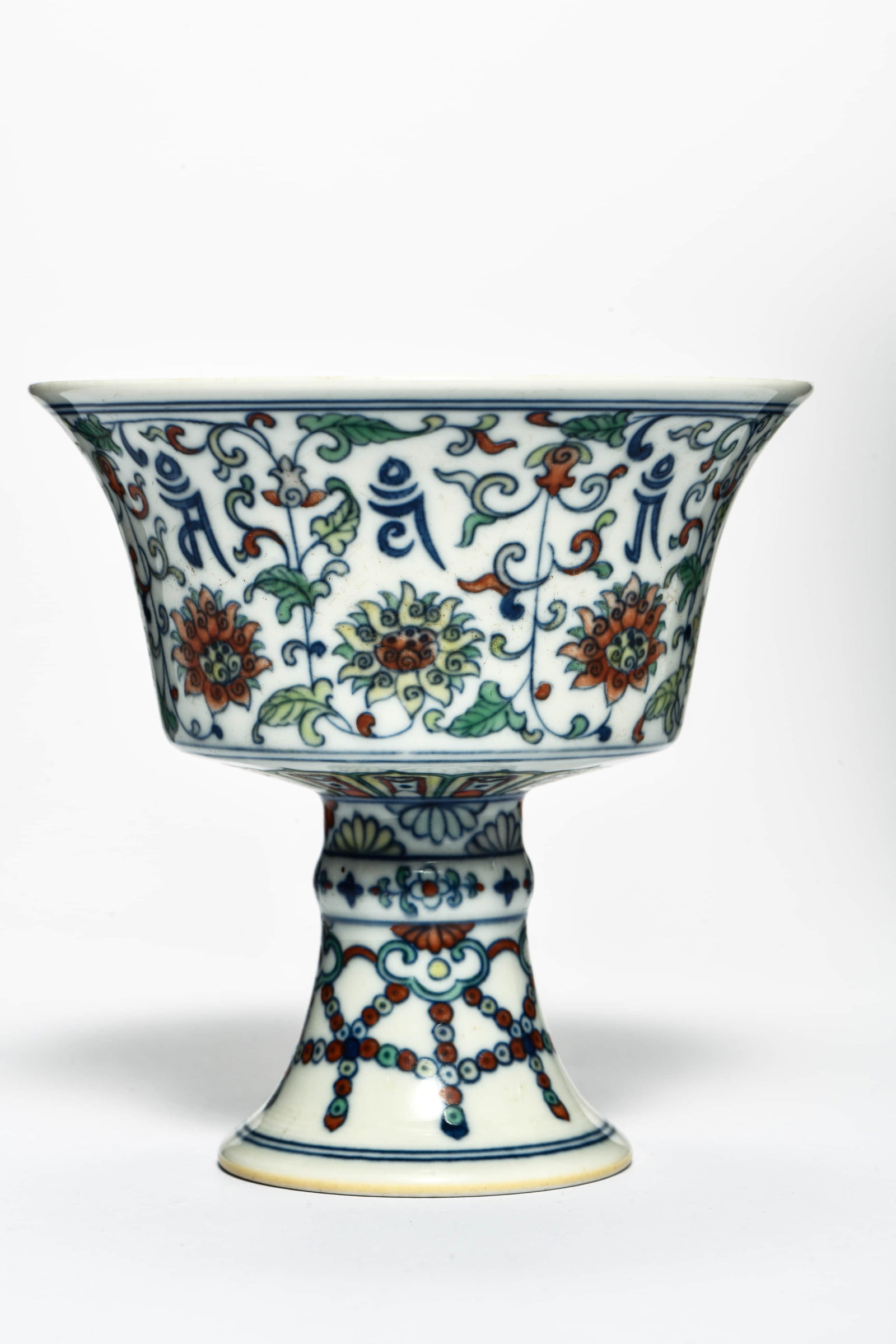 A doucai 'Sanskrit script and Eight Buddhist Emblems' stem cup - 2