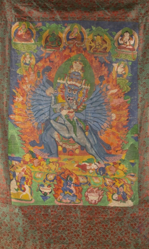 "Vajrabhairava Yamantaka in Yab-Yum" Tibeto-Chinese Thangka Distemper on Cloth: Medium: Distemper on Cloth Style: Tibeto-Chinese Thangka Painting Size: 34 x 24 inches Frame Size: 47 x 29 inches Condition: This artwork is in fair condition for its age, the thangka displays widespr