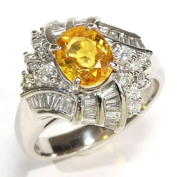 Vintage White-Metal Yellow Gemstone and Diamond-Style Cocktail Ring: VINTAGE WHITE-METAL YELLOW GEMSTONE AND DIAMOND-STYLE COCKTAIL RING Provenance and Authenticity: This object is presented as a vintage white-metal cocktail ring centered by a prominent oval-cut yellow