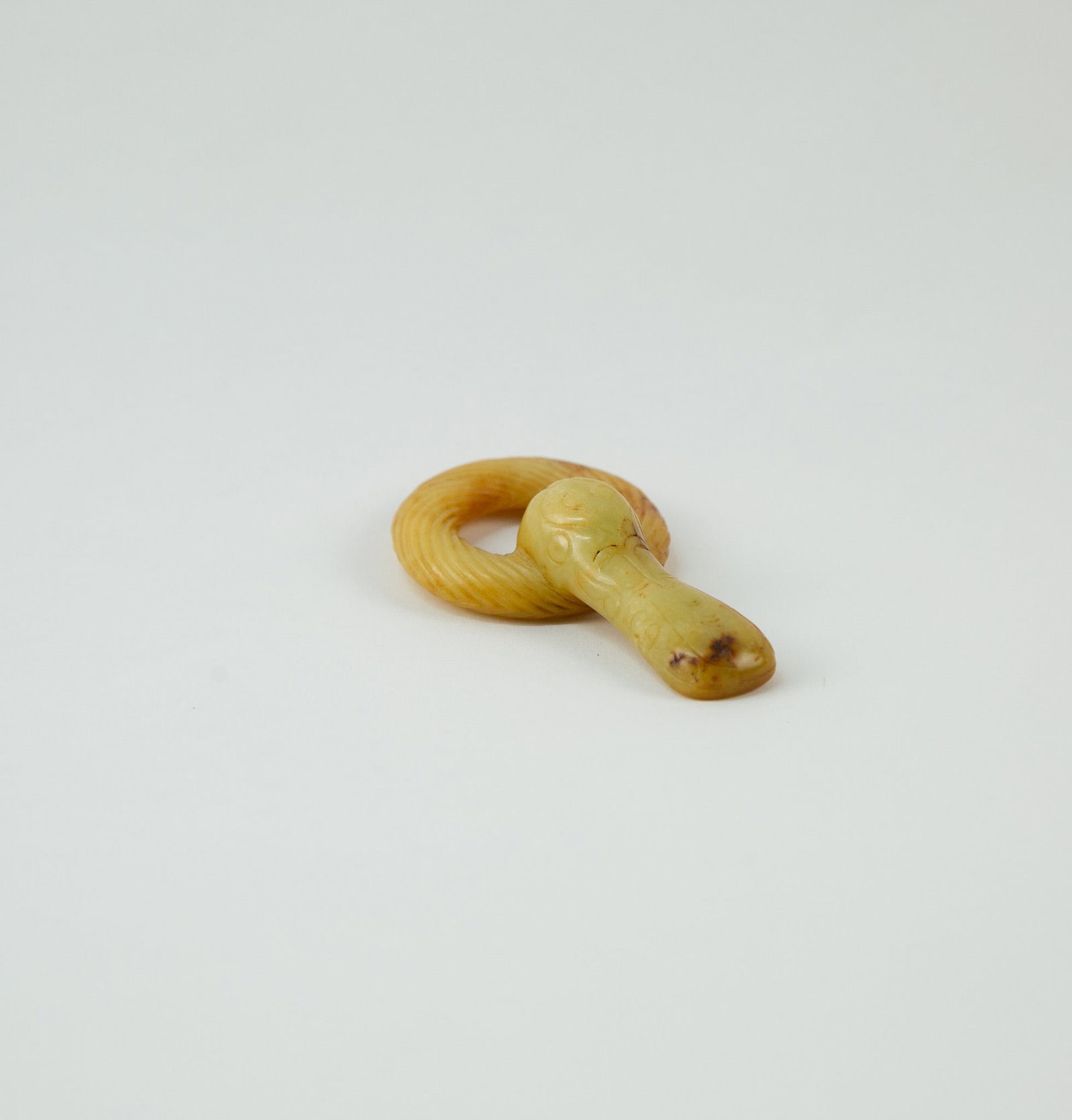Han Dynasty Jade Belt Buckle: Item Size: 3.5 x 2 x 0.5 inches Condition: This item is in great condition for its age. Originally a suspension ring from an ancient belt, intended to be worn at the waist for suspending personal