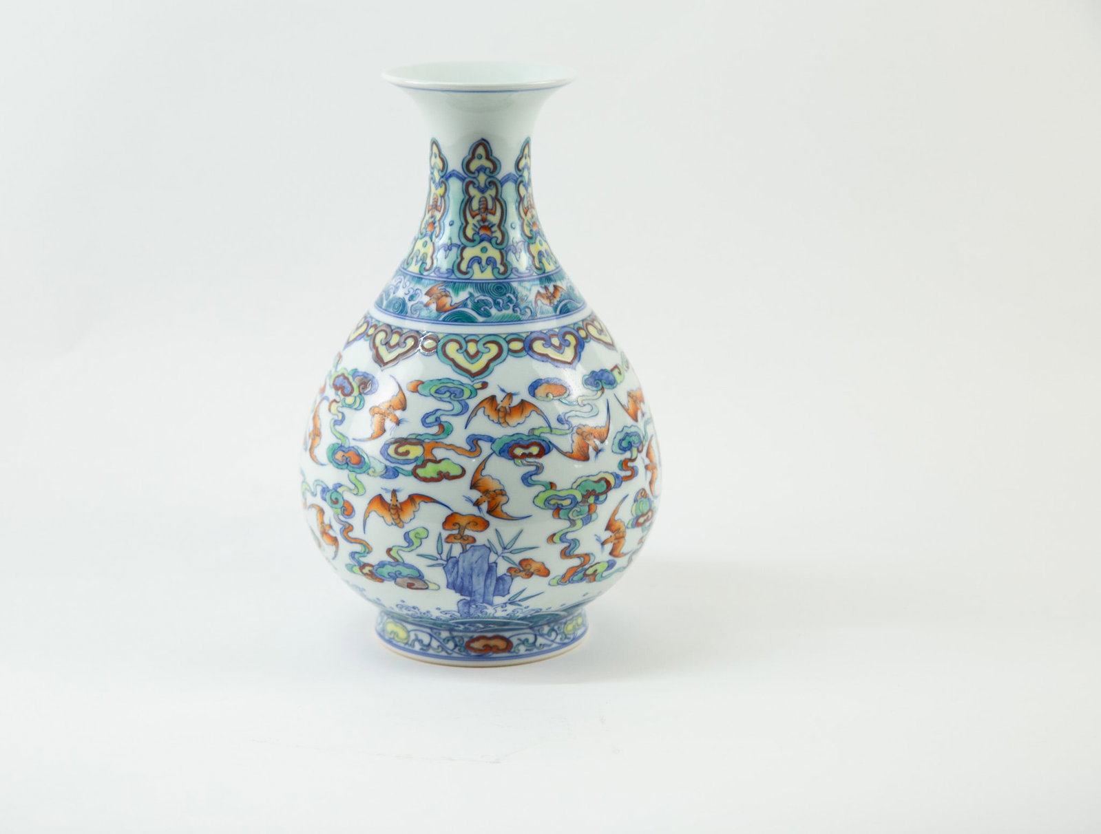 Doucai “Clouds and Bats?? Jade-Hu-Shaped Vase: Item Size: 6 x 10 inches Condition: This item is in great condition for its age. Of classic yuhuchunping form, with softly rounded contours, this is a traditional decorative vase suitable for display 