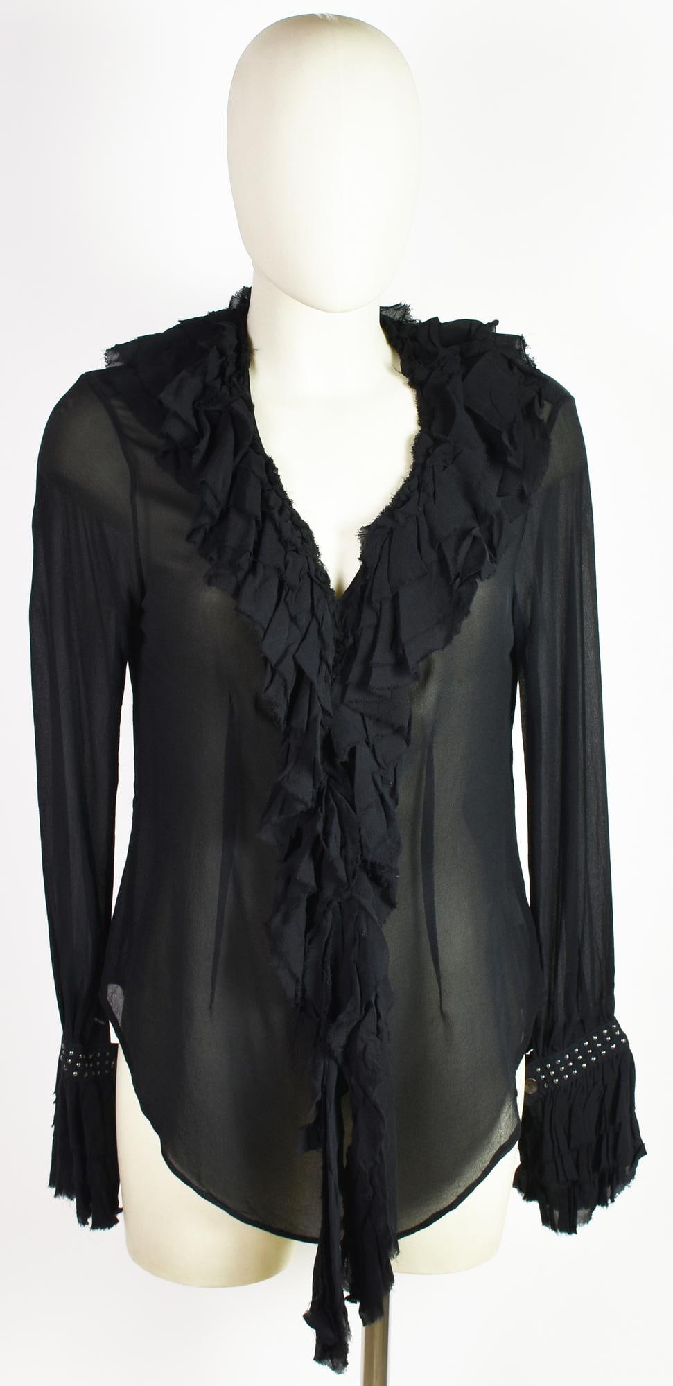 Anna Molinari SILK SHIRT: Anna MolinariSILK SHIRTDESCRIPTION: Black silk shirt with ruffle detail on the sleeves. Size 42 IT. 100% silk. Made in Italy. Perfectly preserved.DESCRIZIONE:Camicia in seta nera con decoro a rouches