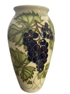 Moorcroft Grapevine Vase by Sally Tuffin for the Moorcroft Collector Club BOXED: A Moorcroft Pottery vase, ‘Grapevine’ designed by Sally Tuffin for the Moorcroft Collectors Club Exclusive 1987 Shape 393A cream-colored ground vase in a grapevine motif and detailed tube