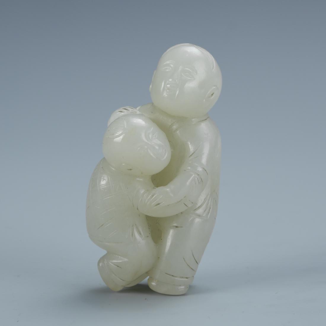 Carved White Jade of two boys playing (1 of 5)