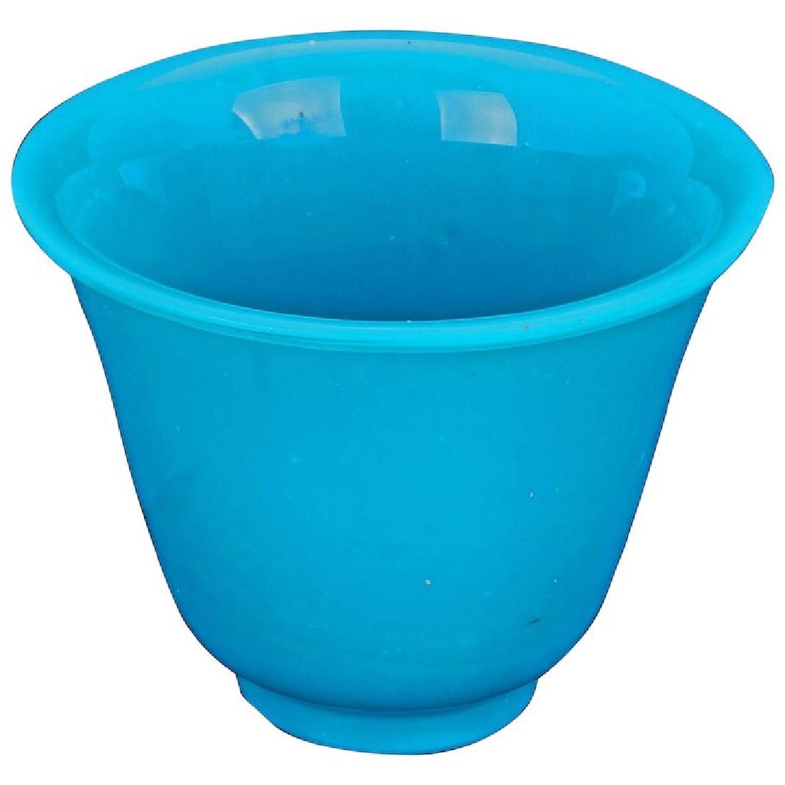 Chinese 19th century turquoise Peking glass tea cup or: A nice heavy, colorful, old Peking glass cup that shows wear on the foot. When held to a light, it has a beautiful translucent robin egg blue color. A heavy glass that has been molded and then carved