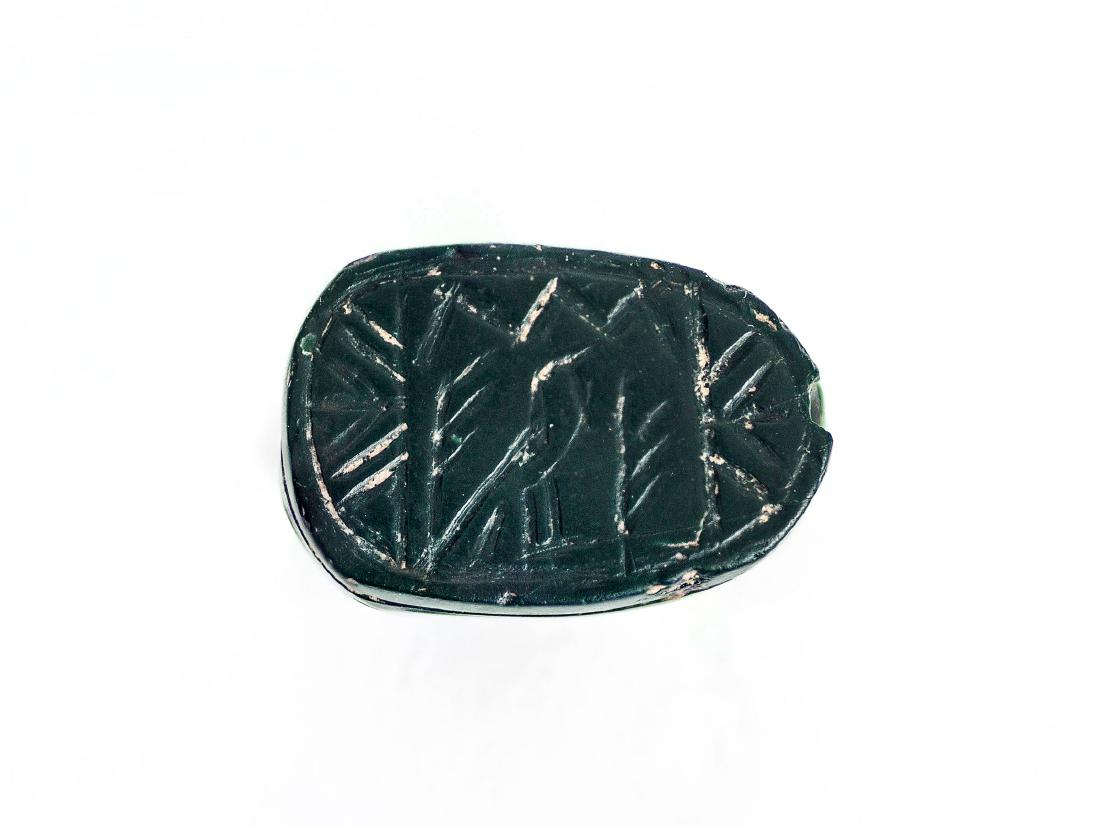 A Late Bronze Age Ancient Canaanite Green Jasper Scarab: A Late Bronze Age Ancient Canaanite Green Jasper Scarab Seal, Circa 1400 BCE Description: Engraved with a view of Nile delta (probably). No repairs, no restoration. Intact. Length: 14 mm A high qualit