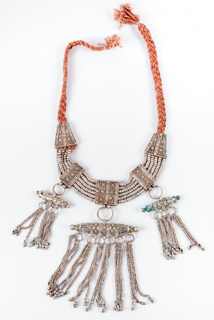 A Fine Silver "Lazem" Necklace, Yemenite, 19th Century: A Fine Silver "Lazem" Necklace, Yemenite, 19th Century Composed of rectangular plates decorated with filigree work, connected by six rows of silver beads. The three central plates terminating in suspe