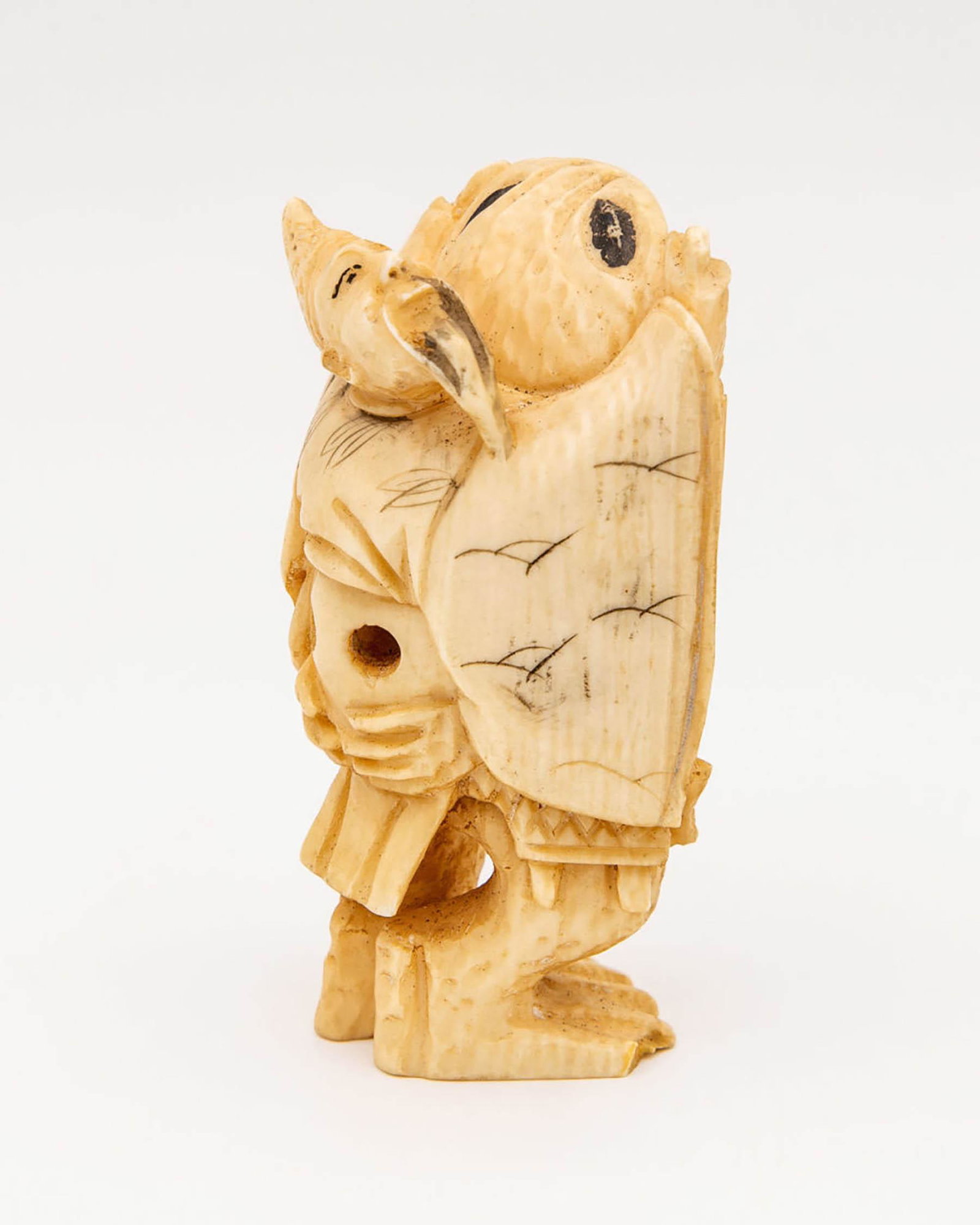 A Carved Netsuke of a Man Flying on a Bird, Japan,: A Carved Netsuke of a Man Flying on a Bird, Japan, Meiji Period (Second Half of the 19th Century) Signed (on the underside). Height: 6 cm
