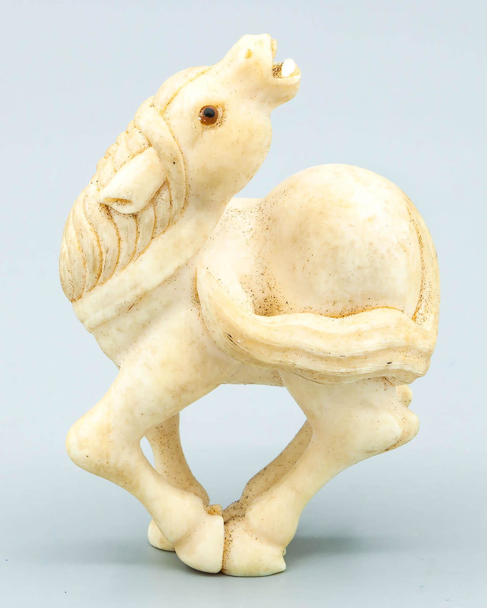 An Antique Japanese Carved Okimono of a Horse: An Antique Japanese Carved Okimono of a Horse Height: 7 cm