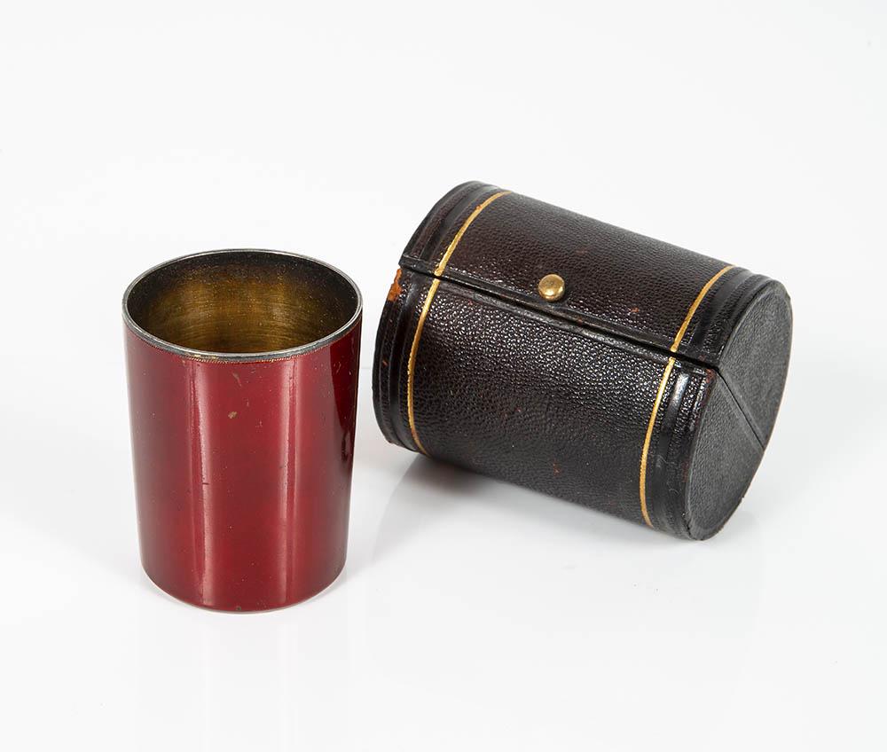 A Charming Silver Parcel Gilt and Enamel Traveling: A Charming Silver Parcel Gilt and Enamel Traveling Beaker, Russia, Saint Petersburg, 1894 The exterior enameled in shades of crimson and the exterior gilt. Including an original leather traveling case