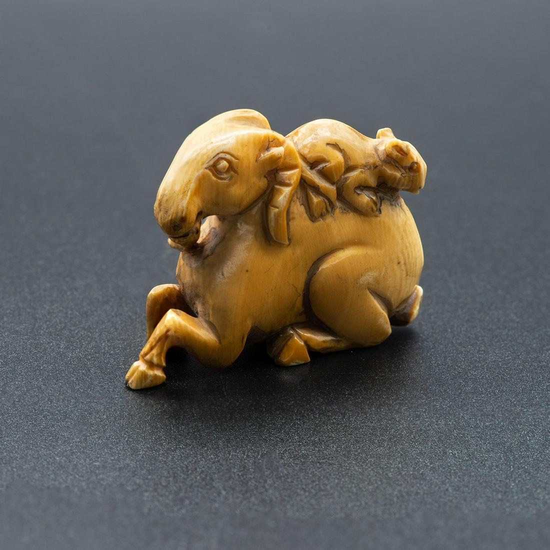 A Carved Netsuke of a Ram and Rat Zodiacs, Japan,: A Carved Netsuke of a Ram and Rat Zodiacs, Japan, ca.1940 Signed (on the underside). Height: 4 cm Condition: For a detailed condition report, please contact us at info@hammersite.com