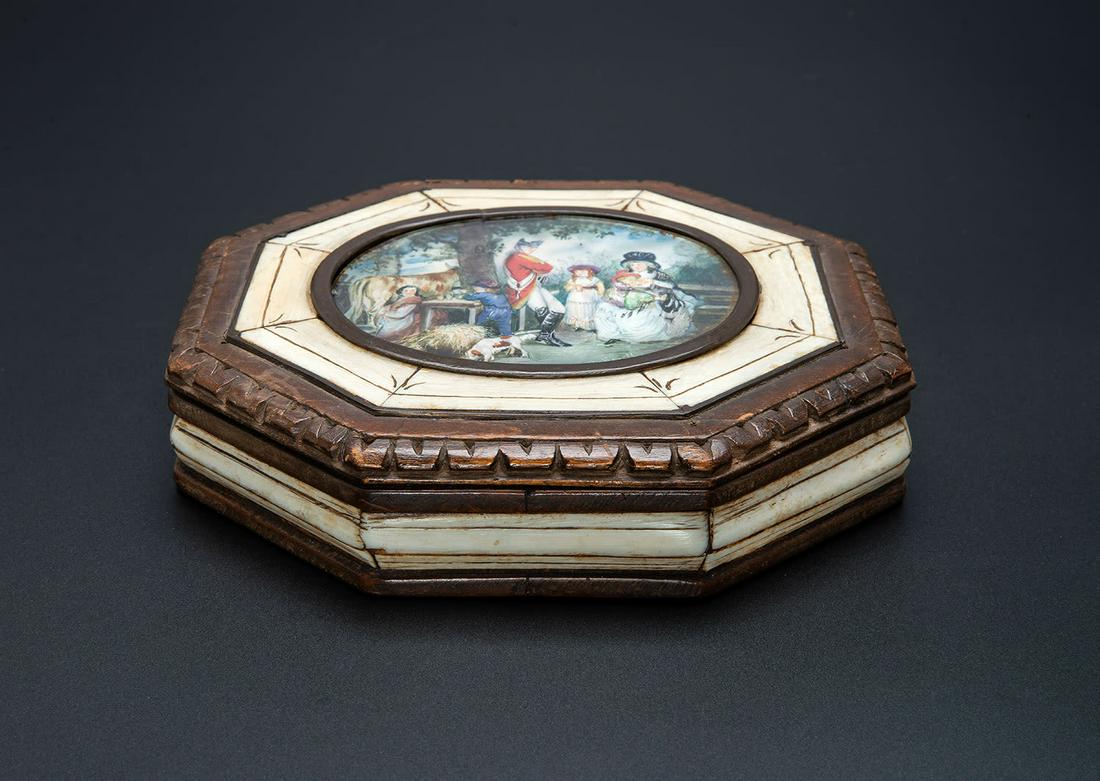 A Wood Box with a Miniature, Germany, 18th Century: A Wood Box with a Miniature, Germany, 18th Century An octagonal hinged box accented with "bone". The lid centered by a miniature depicting a family scene, signed J.Brandl. </