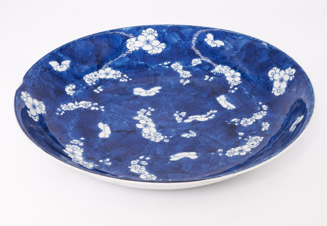 A Blue and White Porcelain Charger, China Qing Dynasty: A Blue and White Porcelain Charger, China Qing Dynasty , Kangxi Period (1654-1722) Decorated with cherry blossoms on a blue ground. Diameter: 34 cm