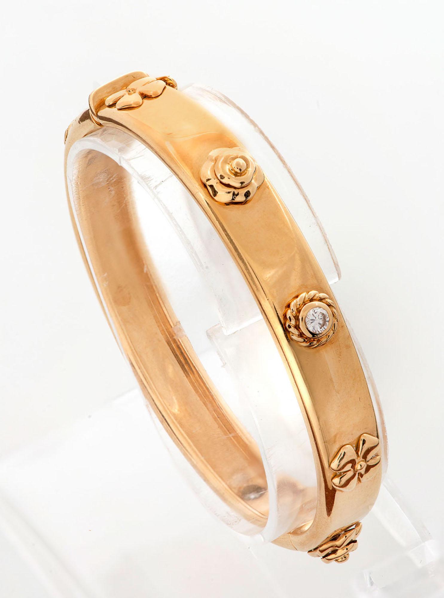 A Chanel "Three Symbols" 18K Gold and Diamond Bangle (1 of 4)
