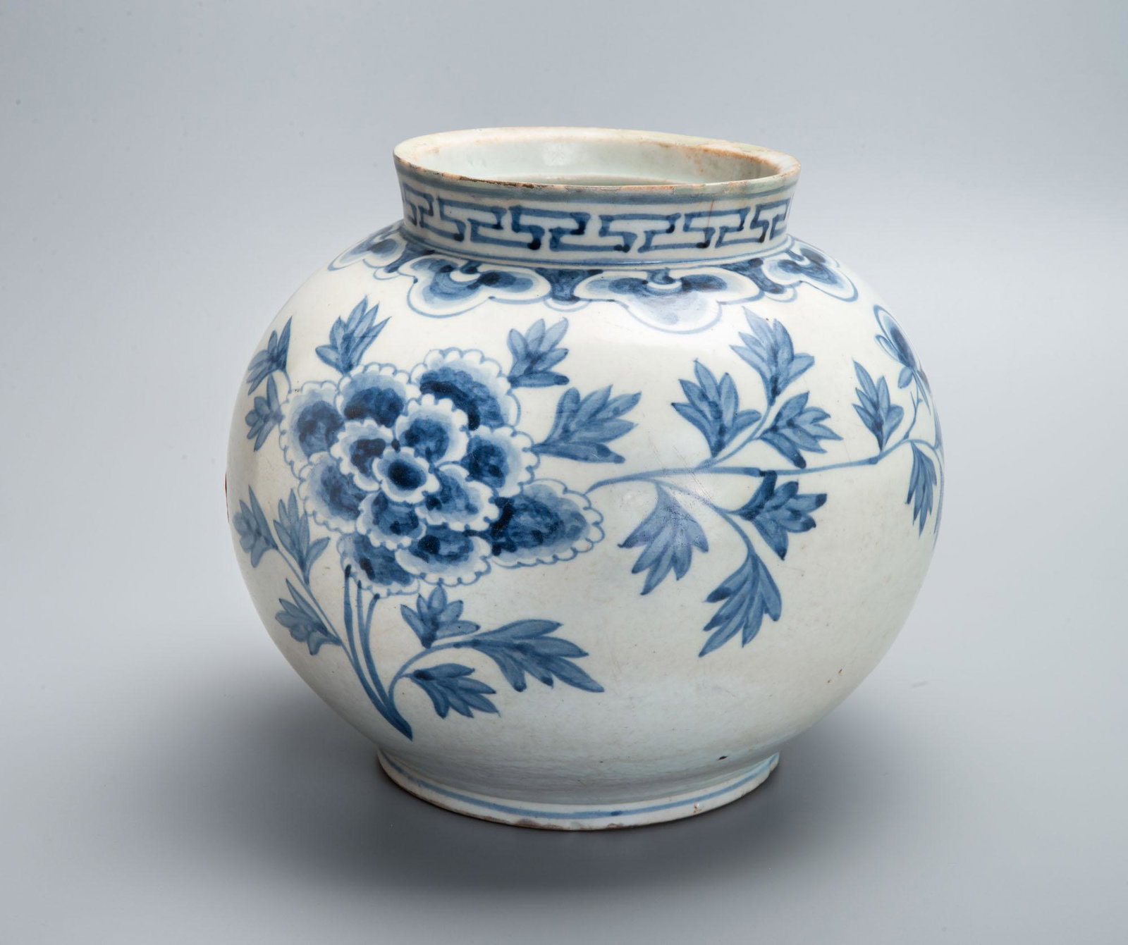 A Fine Large Blue and White Porcelain Jar, Korea, Joseon Dynasty, 19th Century: A Fine Large Blue and White Porcelain Jar, Korea, Joseon Dynasty, 19th Century A globular body raised on a circular base and terminating in a slanted, short neck. Decorated with blooming peonies. Heig