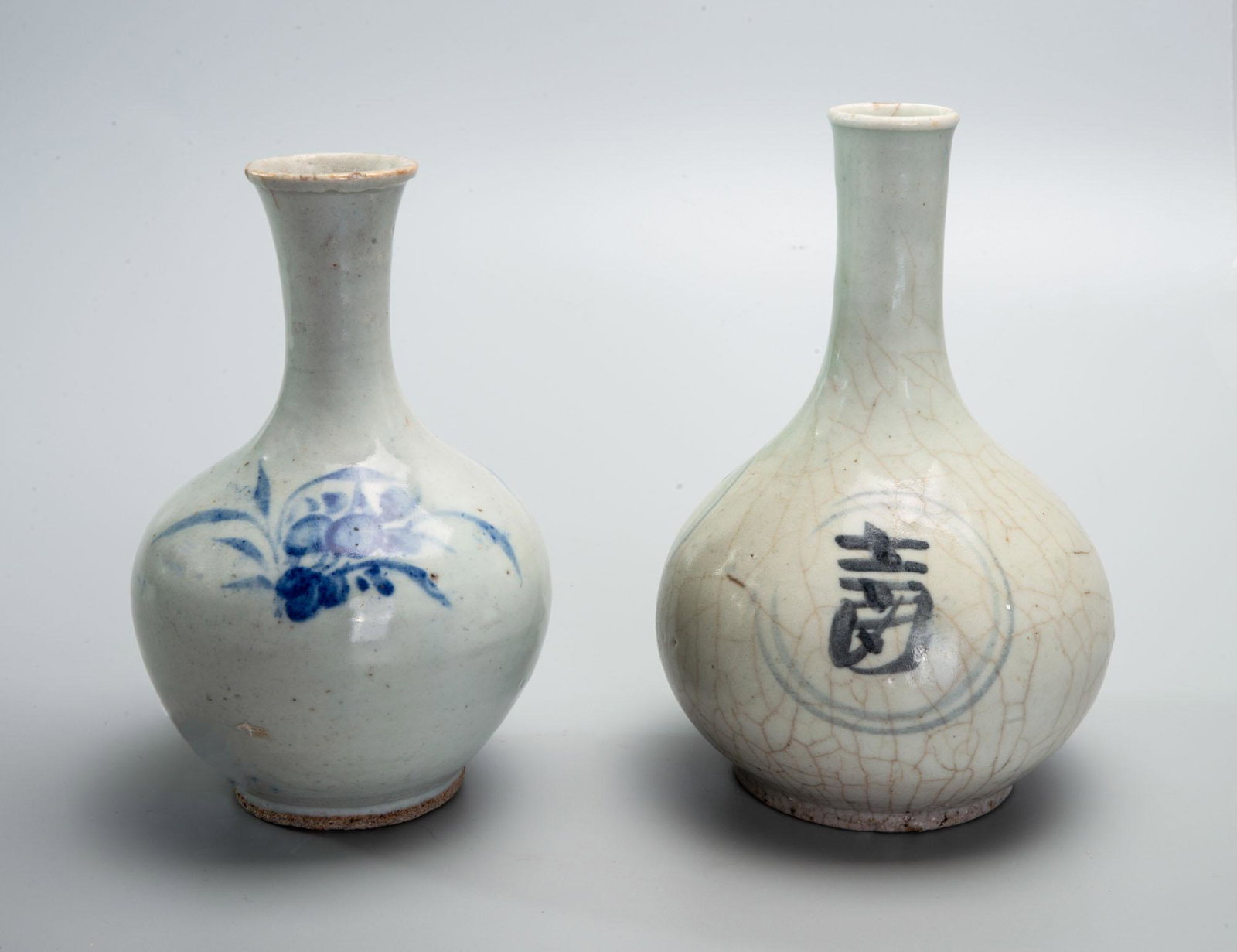 Two Blue and White Porcelain Vases, Korea, Jeoson Dynasty (1392-1910): Two Blue and White Porcelain Vases, Korea, Jeoson Dynasty (1392-1910) Height: 17 cm and 16.5 cm Provenance: Estate of Ruth and Yehuda Horm. Condition: For a detailed condition report, please contact u