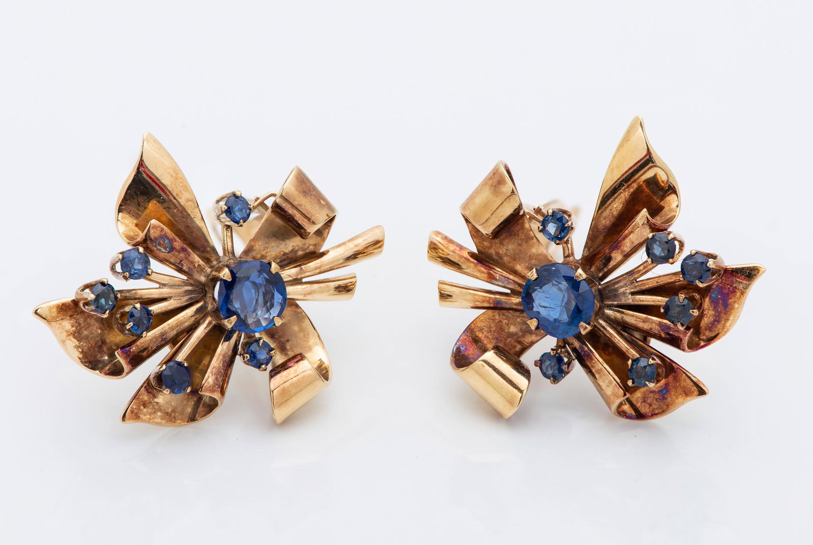 A Pair of Retro 14K Gold and Sapphire Earrings: A Pair of Retro 14K Gold and Sapphire Earrings Designed as a flower accented by tiny sapphire. Marked. Total weight: 10.3 gr, length: 30 mm Condition: For a detailed condition report, please contact u