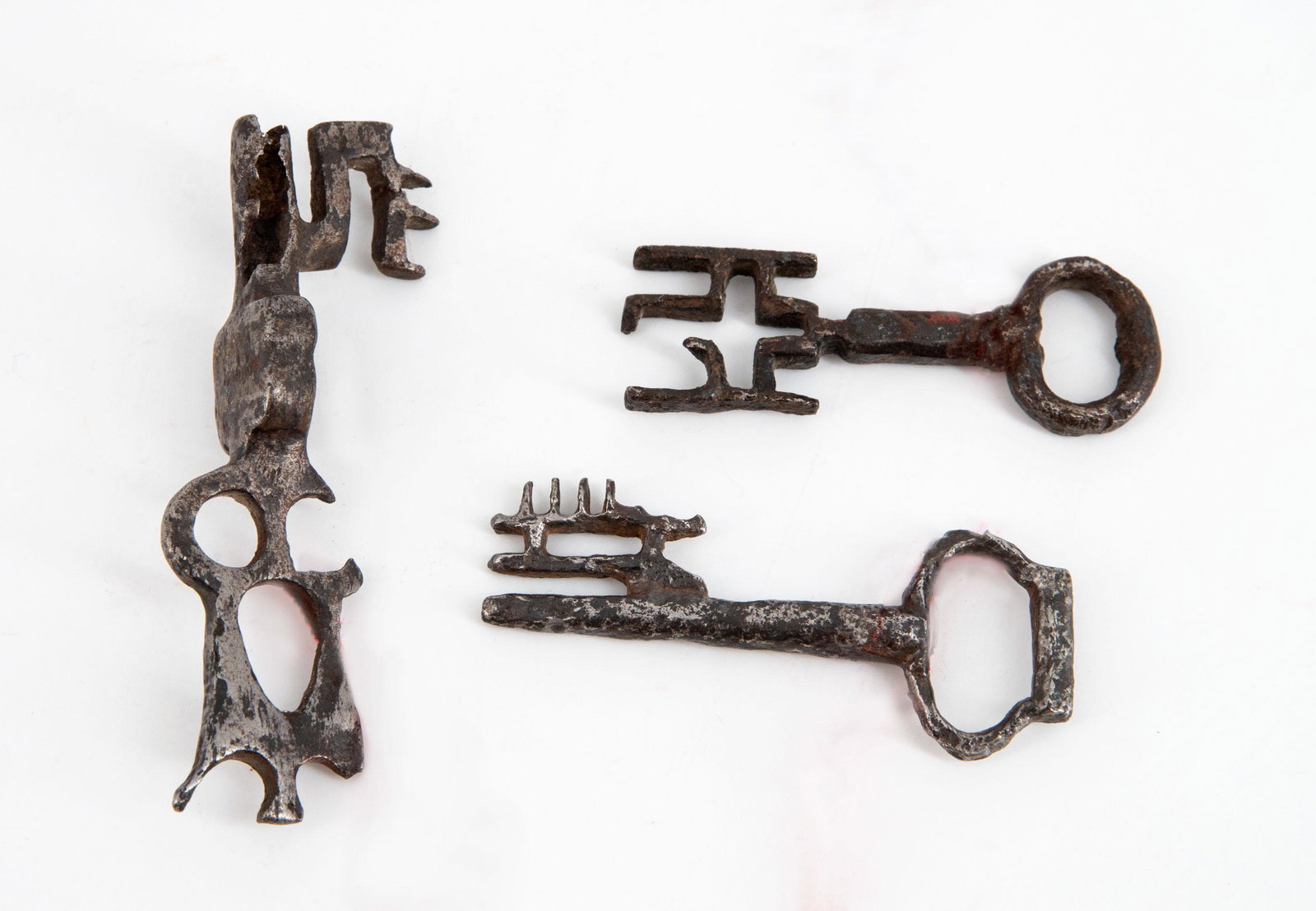 Three Fine Iron Keys, 15th Century: Three Fine Iron Keys, 15th Century Length between: 5.5-7.5 cm Provenance: Estate of Ruth and Yehuda Condition: For a detailed condition report, please contact us at info@hammersite.com