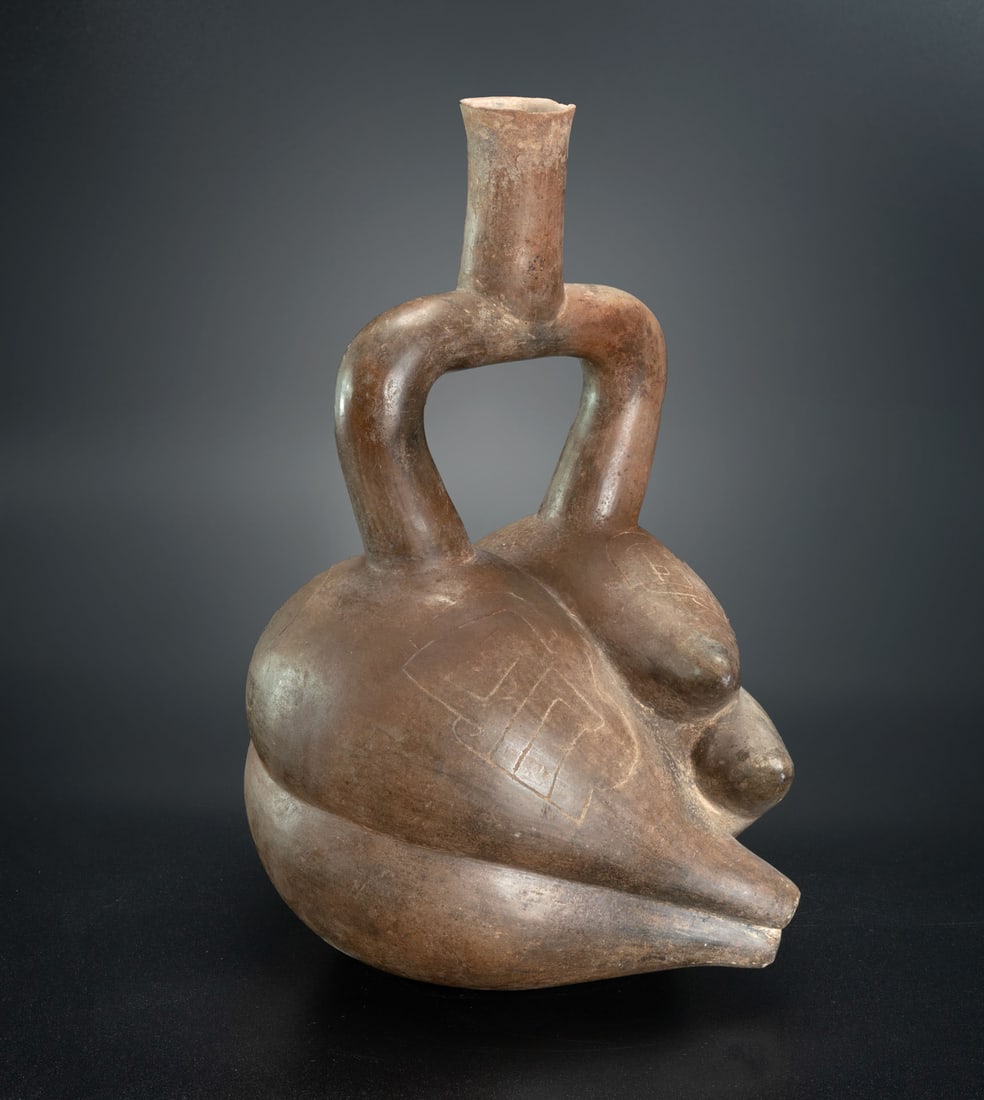 A Manioc Tuber-Shaped Stirrup-Spout Bottle, Cupisnique, Peru, 1200-200 BCE (1 of 5)