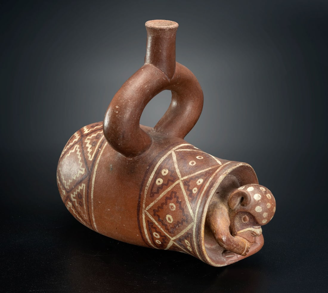 Stirrup-Spout Vessel with Monkey Emerging from a Beaker, Salinar, Peru, 200 BCE-100 CE: Stirrup-Spout Vessel with Monkey Emerging from a Beaker, Salinar, Peru, 200 BCE-100 CE The beaker containing the monkey might also symbolize a funerary bundle, these images were probably associated wi