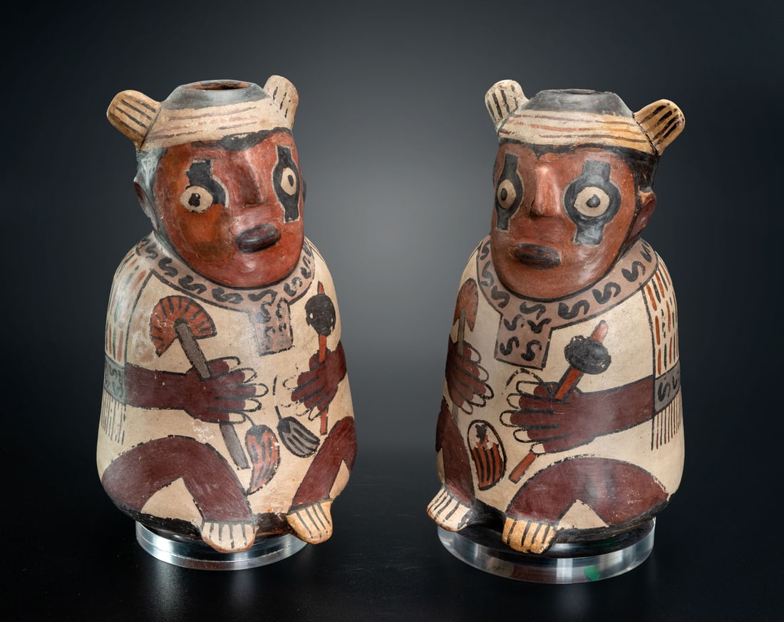 Two Effigy Jars: Seated Male, Early Nasca, Peru, 1-200 CE: Two Effigy Jars: Seated Male, Early Nasca, Peru, 1-200 CE A representation of two seated men, probably farmers, priests or warriors, holding vegetal attributes, tumi knives and clubs in their hands. T